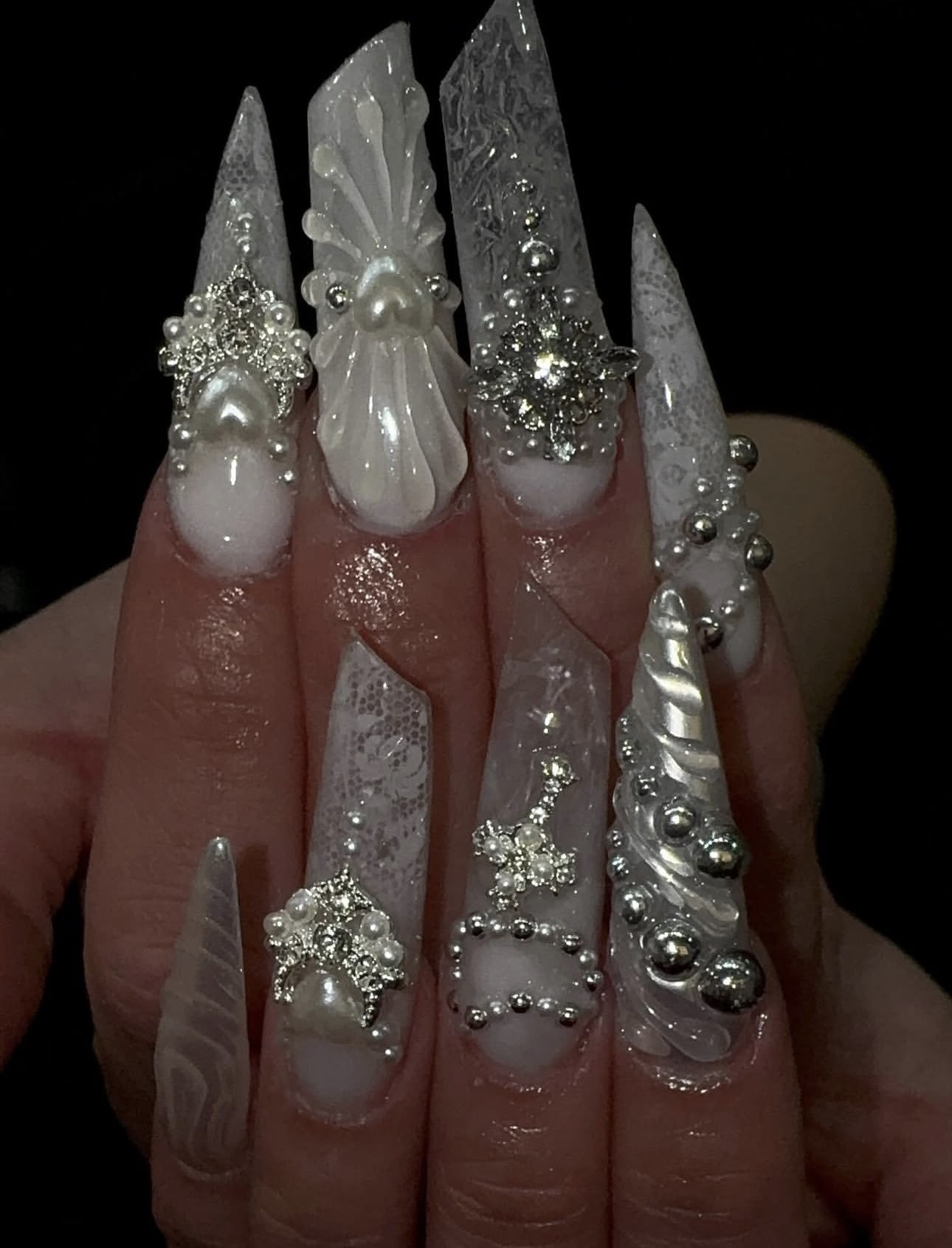White glam nail art with pearls and rhinestones