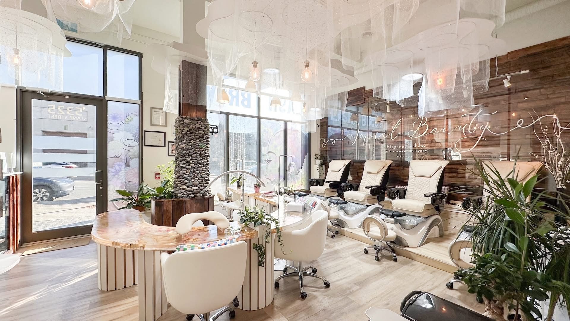 Pedicure lounge and manicure stations at JOVIAL BEAUTY