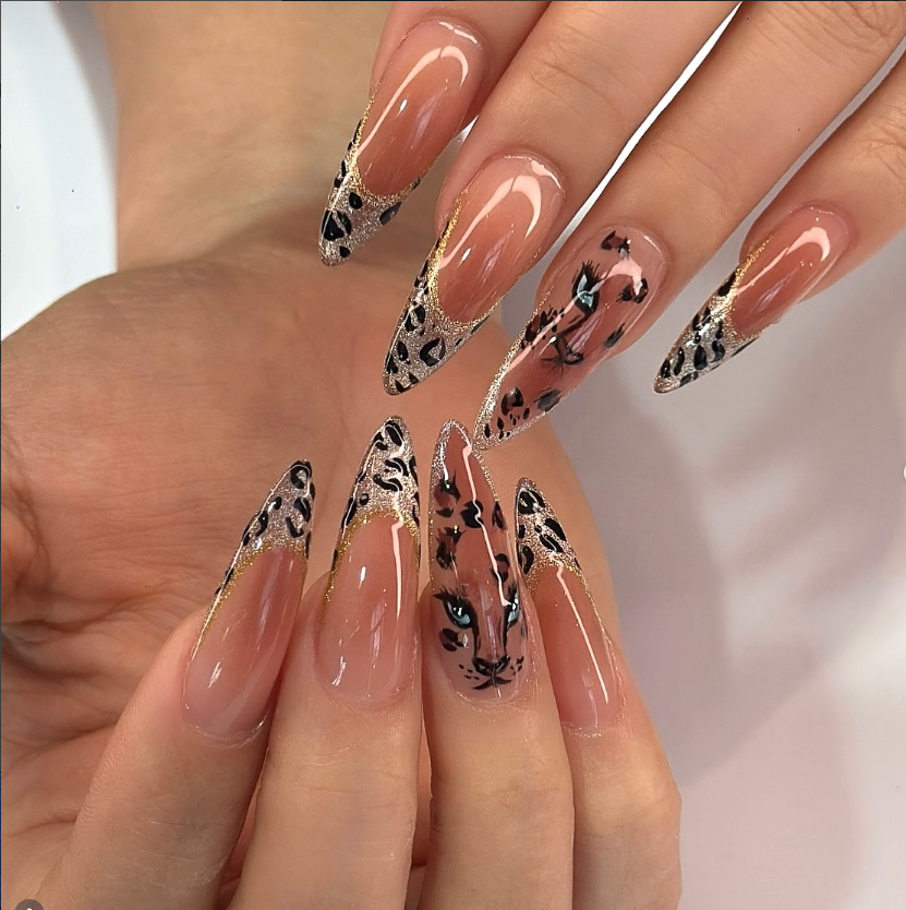 Leopard and gold detailed nail art at Jovial Beauty