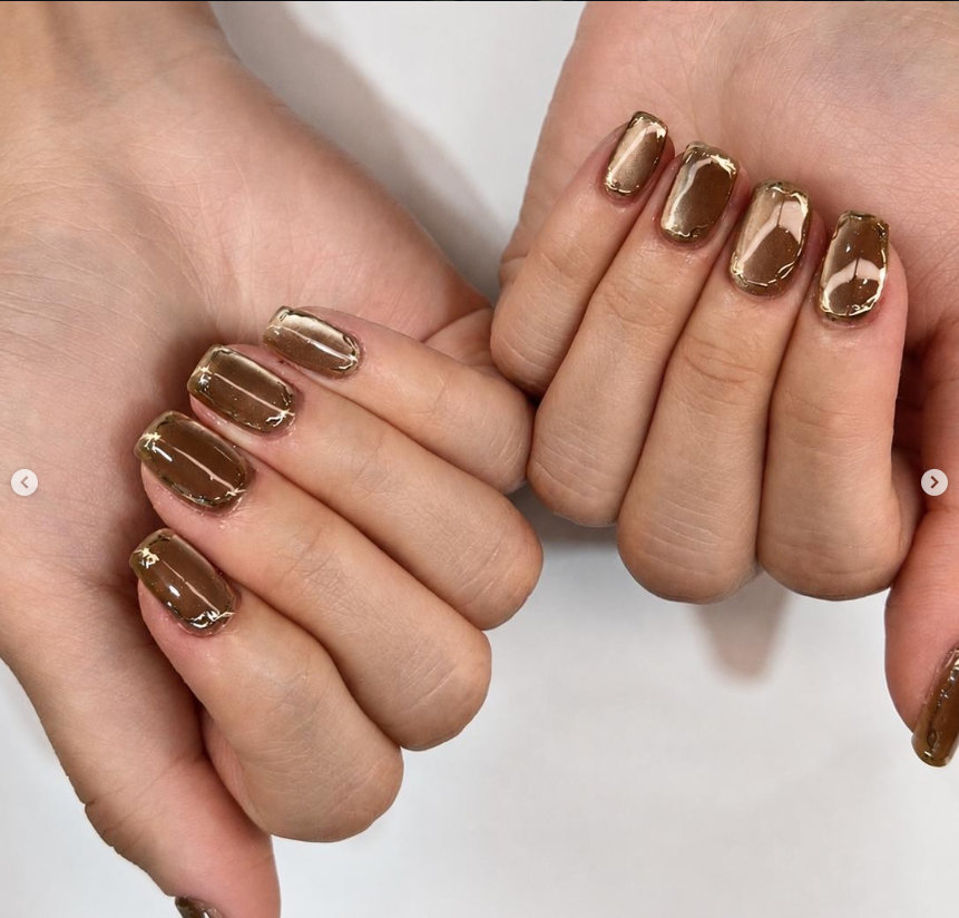 Glossy brown short nails with gold detail at Jovial Beauty