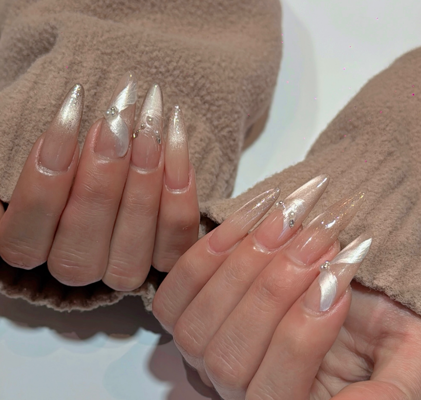 Pearl white almond nail art at Jovial Beauty